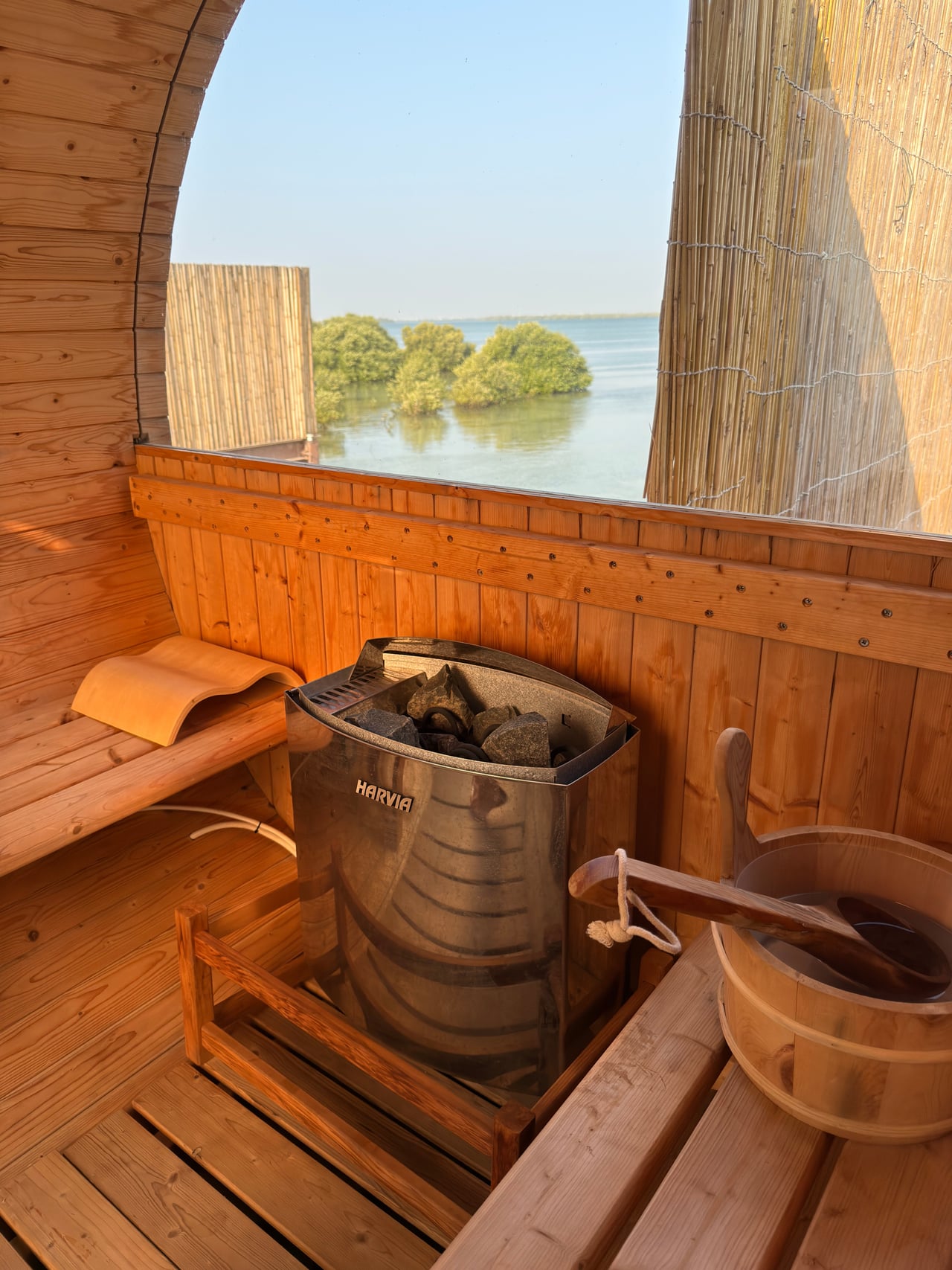 A private outdoor sauna with a mangrove view